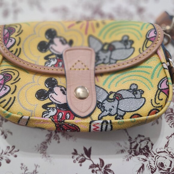 Dooney & Bourke Handbags - Disney Dooney and Bourke Mickey Dumbo Castle Yellow Flap Wristlet